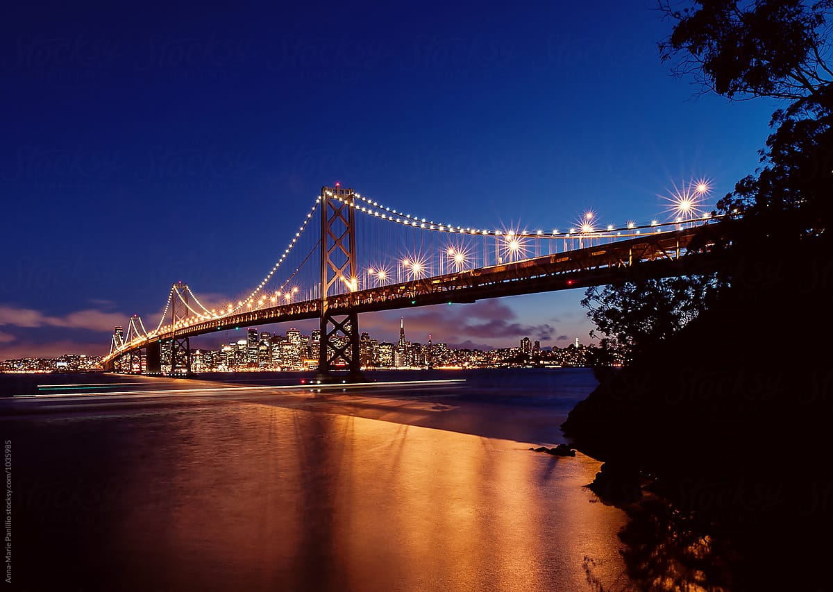 The San Francisco Bay Bridge lit up at night