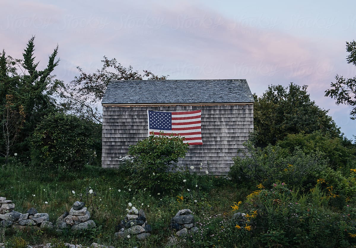 Old rustic shed with American flag