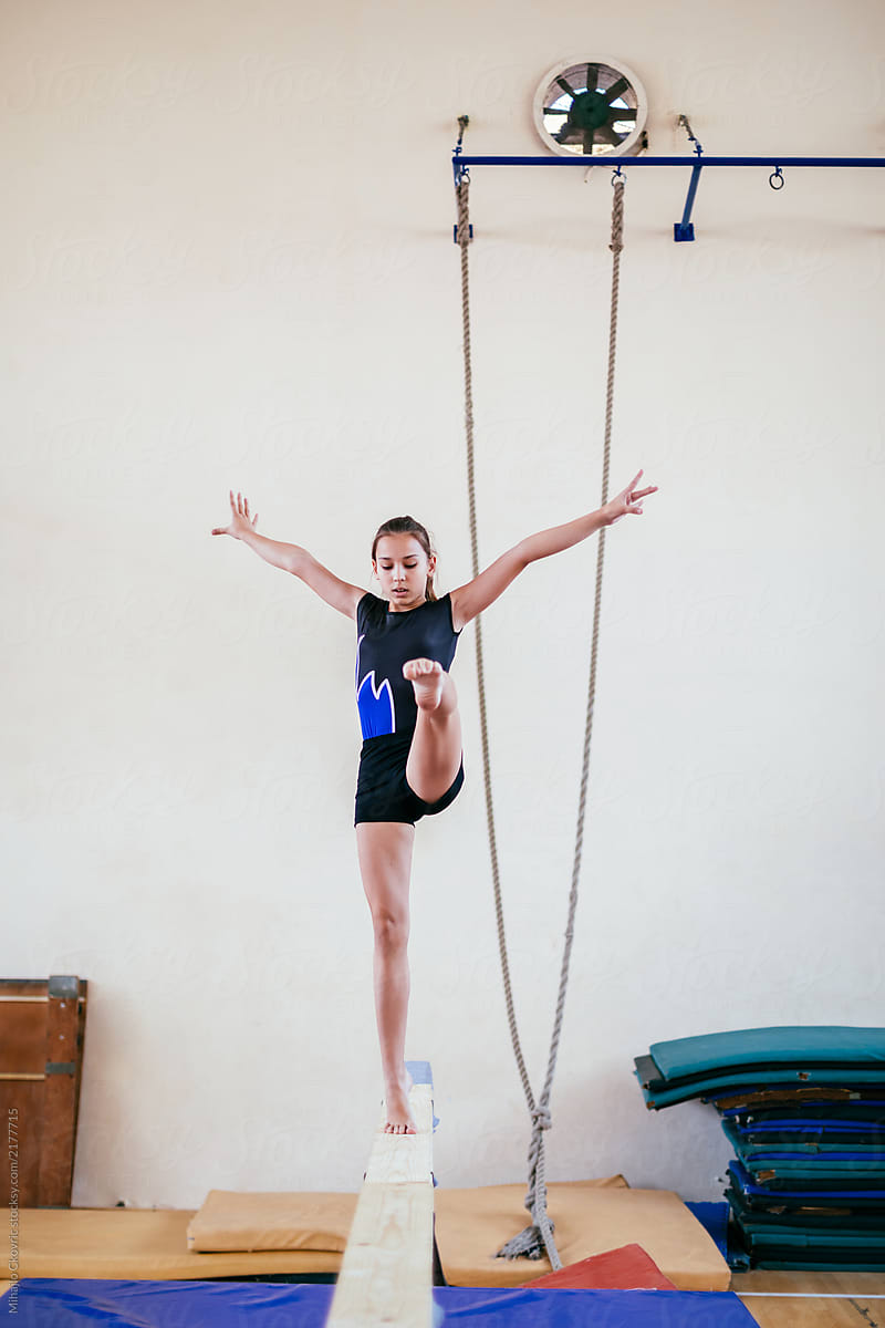 Gymnastics Young Girl Practicing On Balance Beam By Stocksy Contributor Mihajlo Ckovric 