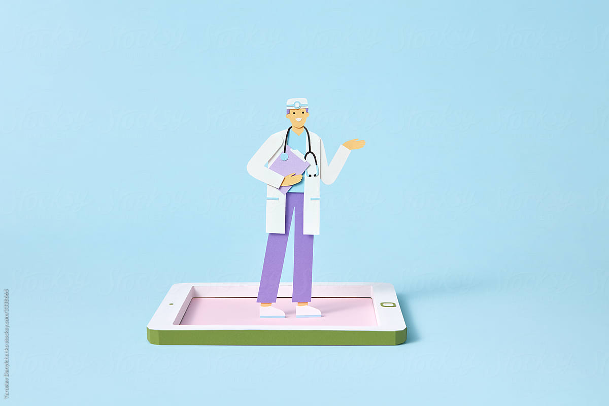 Papercraft doctor is standing on a craft tablet screen.