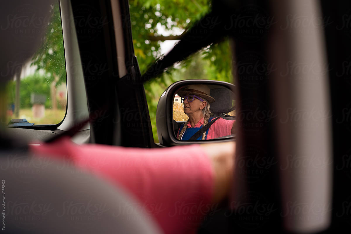 Mature woman passenger in car