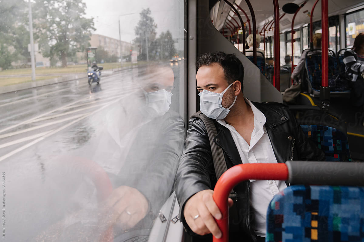 Man Wearing Surgical Mask At Public Transport