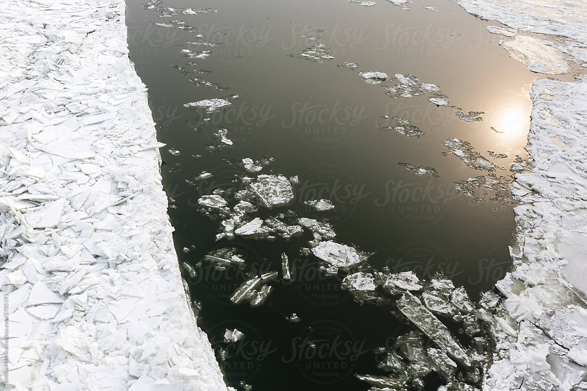Broken ice floating in the river