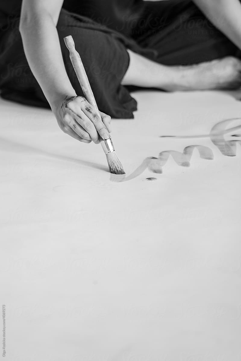 Close up Of Female Artist's Hand Doing Calligraphy