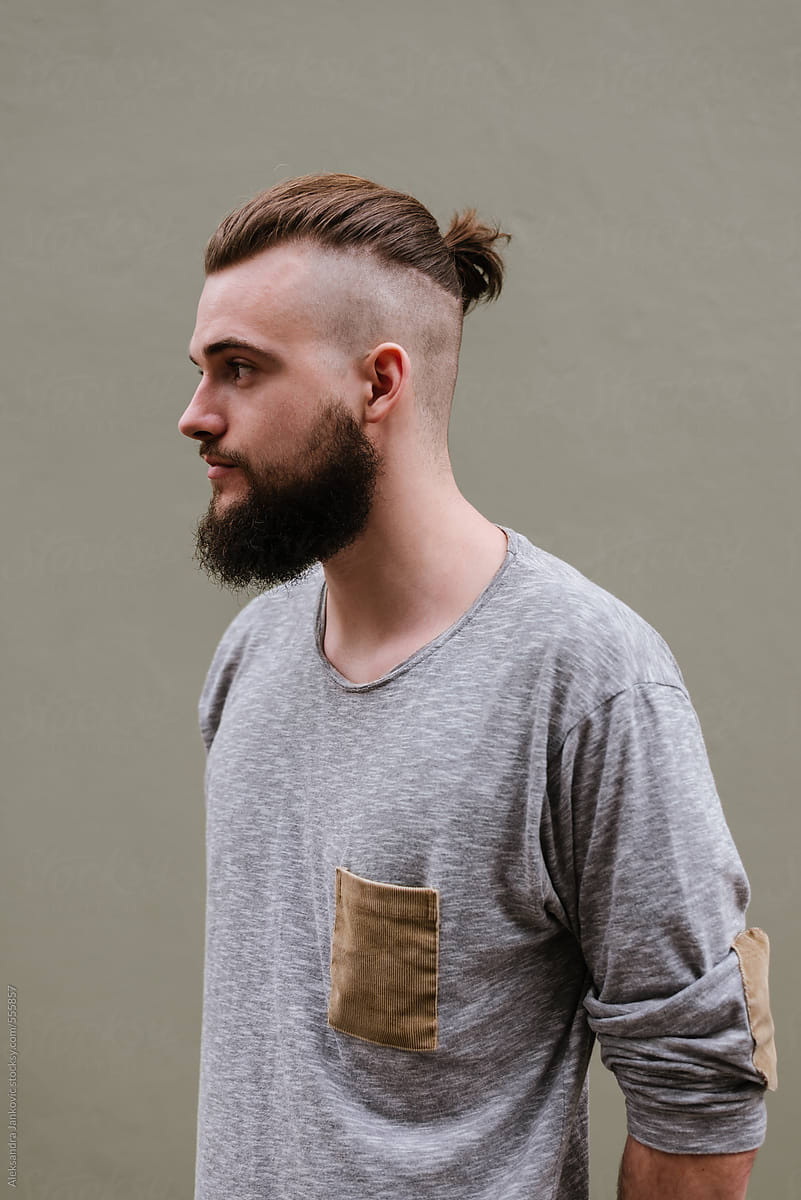 Portrait Of A Handsome Bearded Man With Samurai Bun Hairstyle By