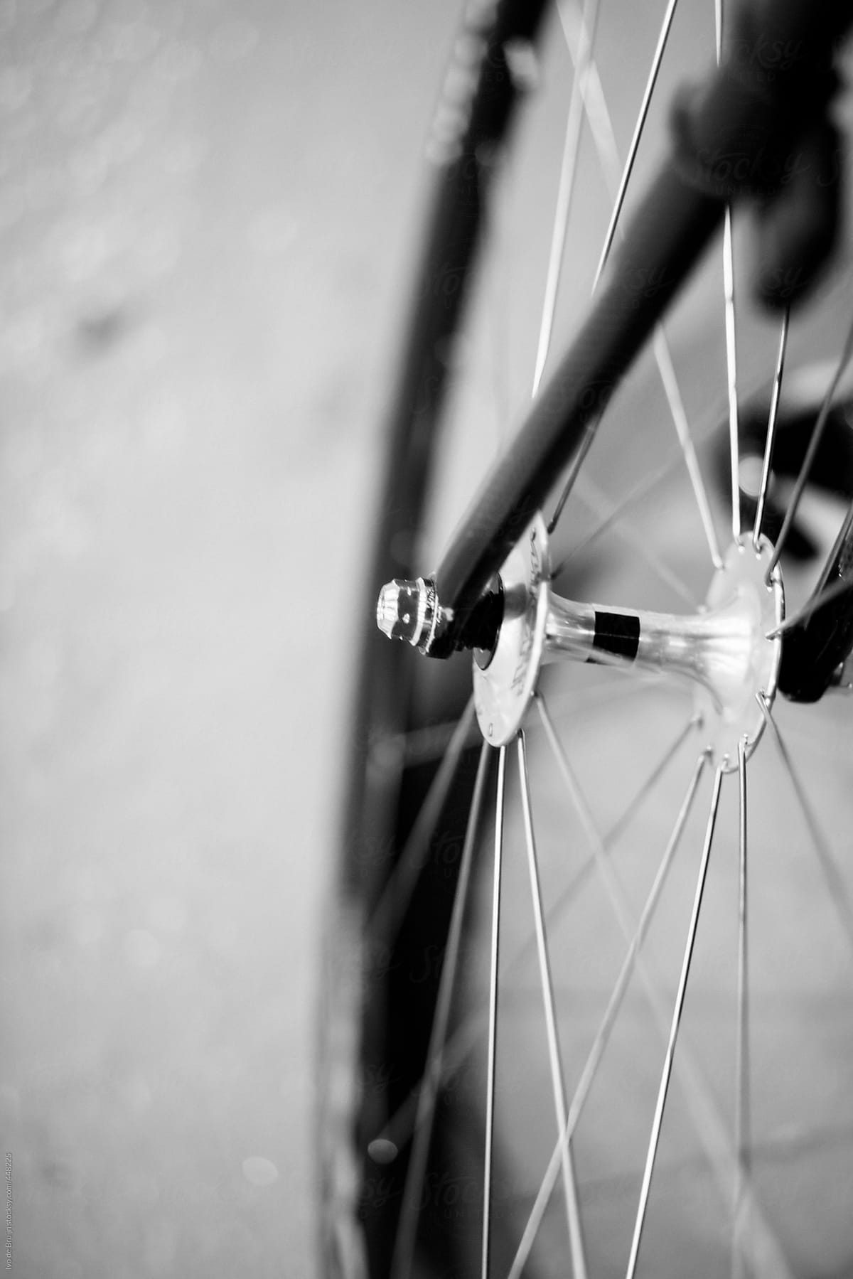 Black and white image of the wheel of a bicycle