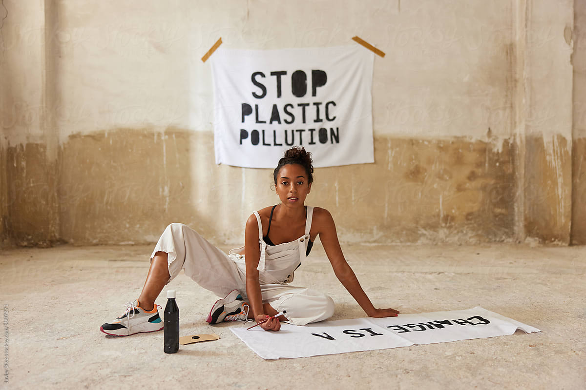 Female activist creating protest poster