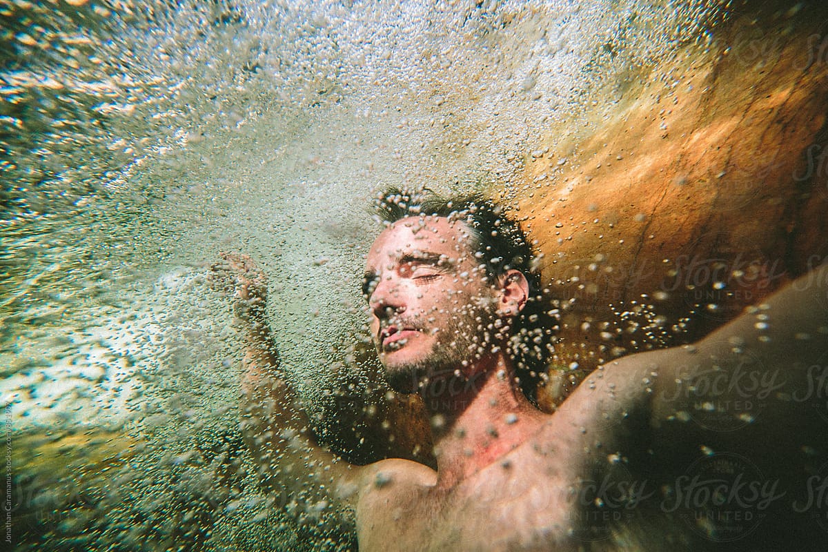 person floating underwater