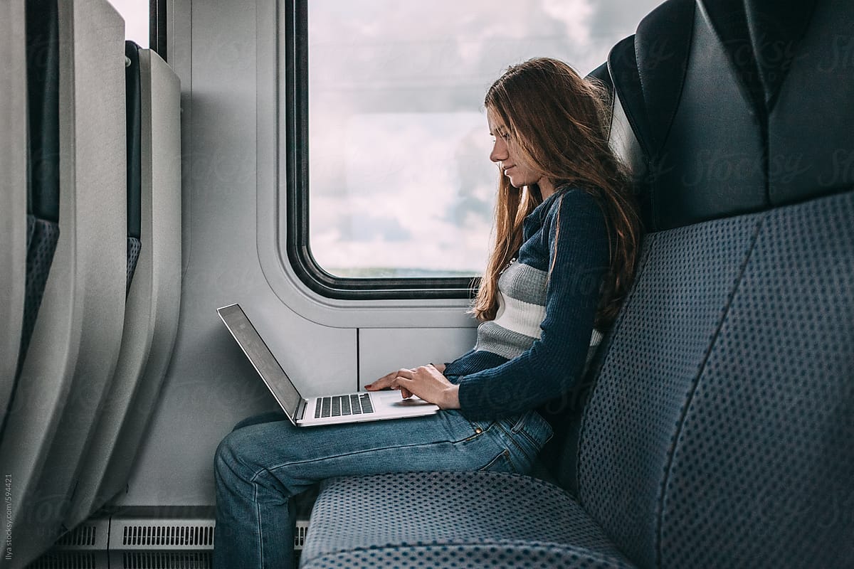 Woman travel by train with laptop
