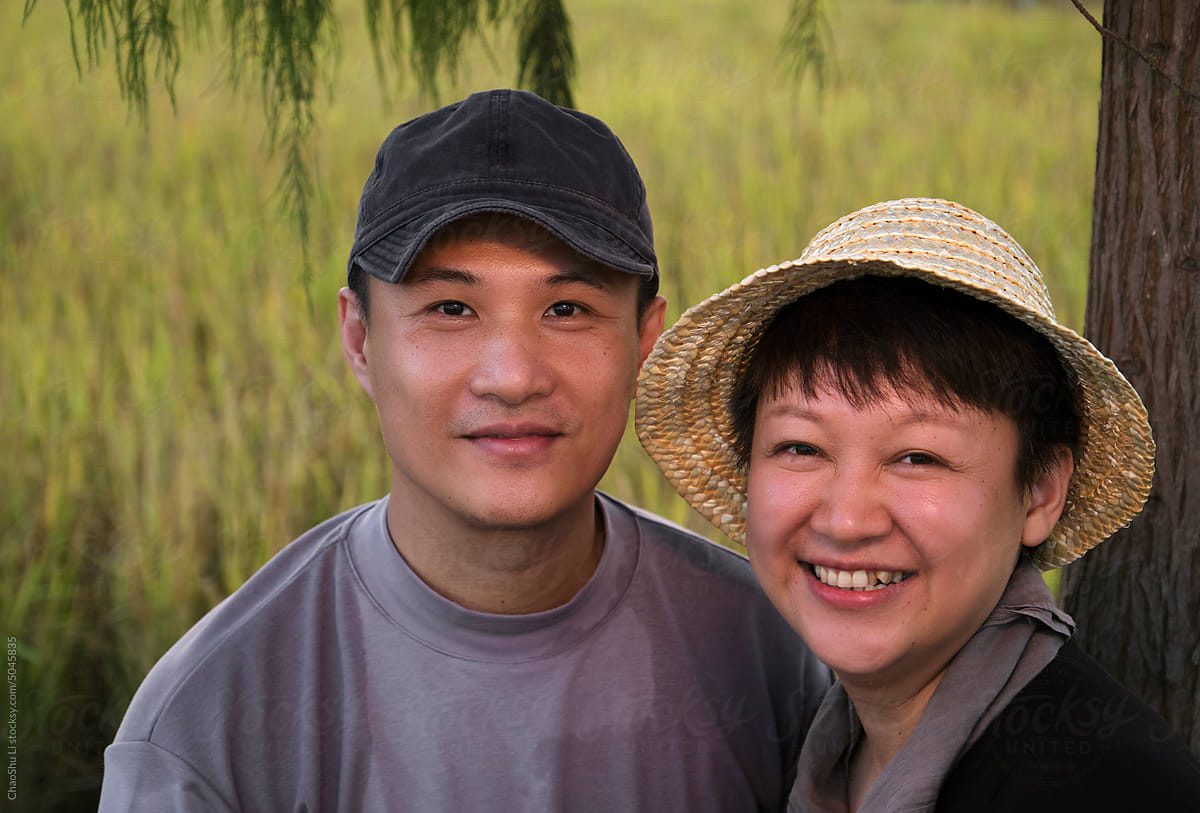 Asian couple next to the rice field outdoors
