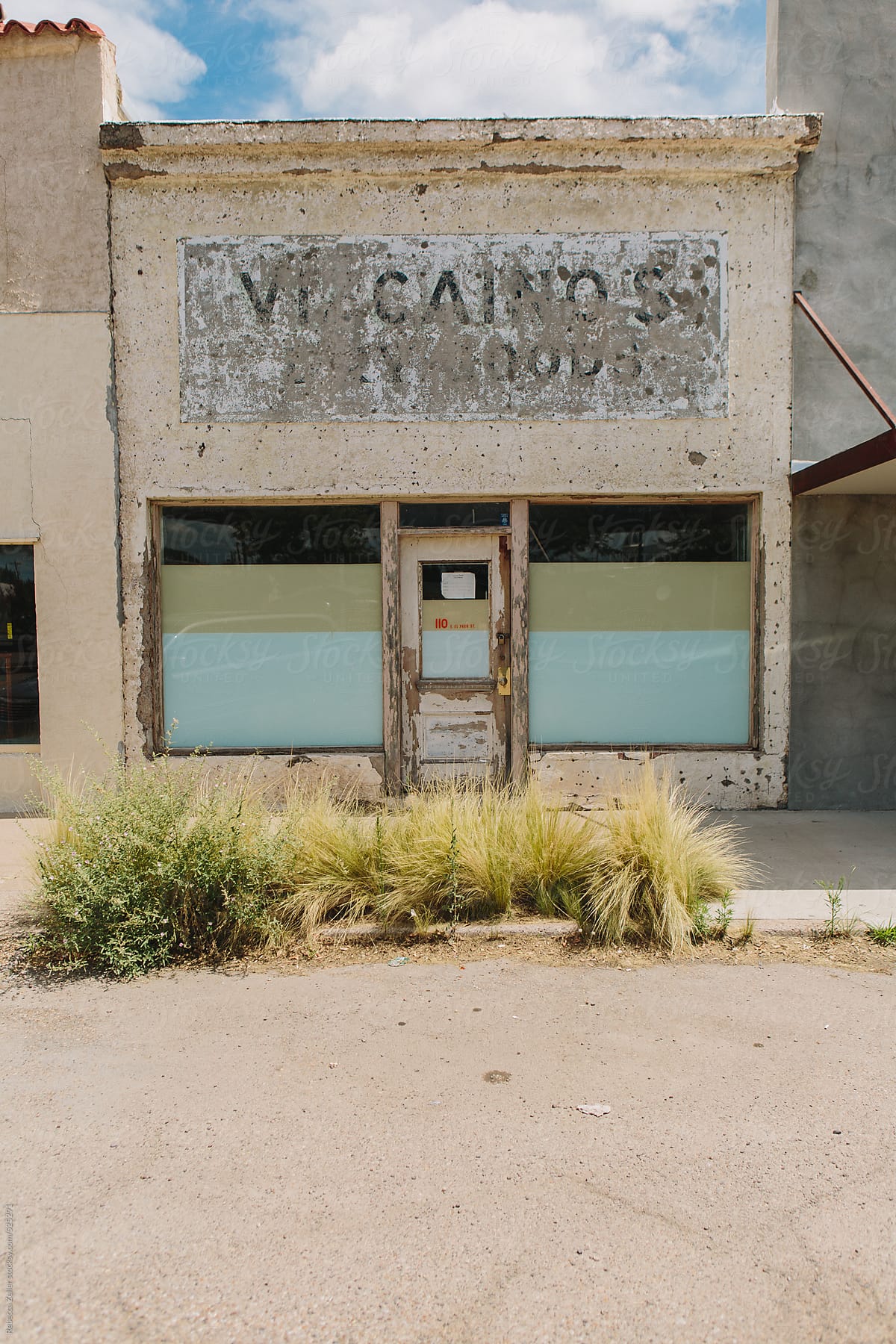 an old, run-down store front in a town in west texas