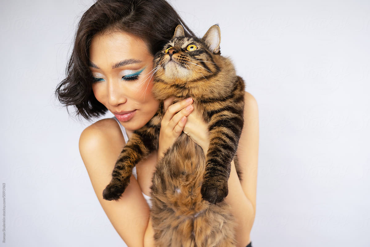 Portrait of Beautiful Young Asian Woman with Bobtail Cat