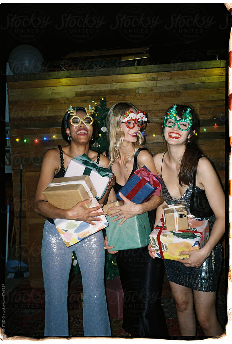 User generated content cool women with present boxes during Christmas
