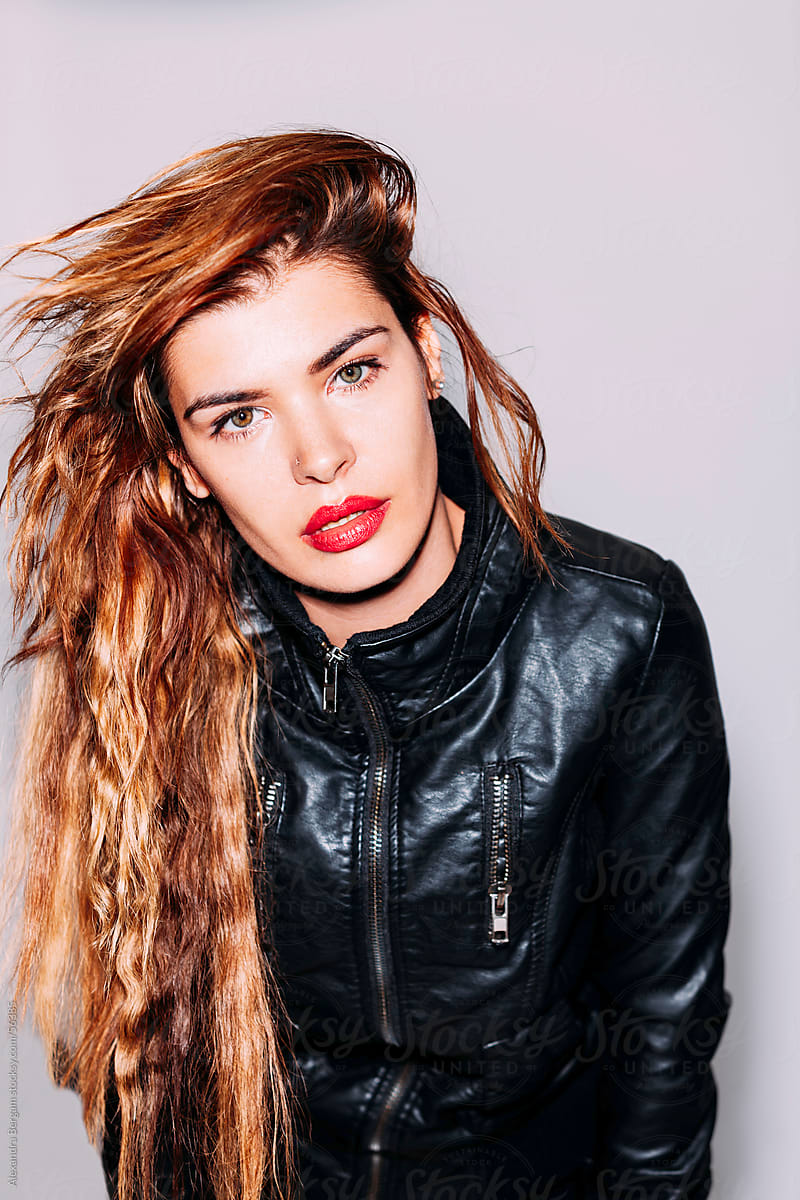 Woman in leather jacket and messy hair