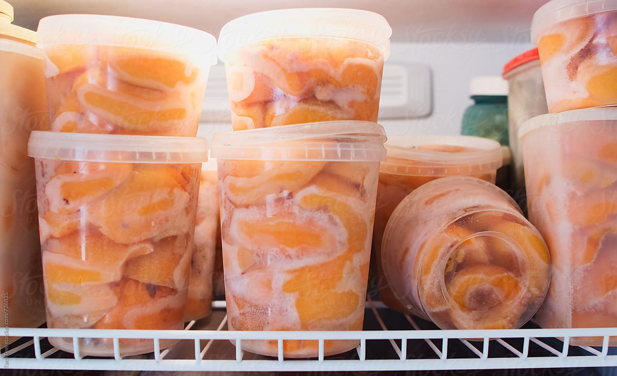 Homegrown peaches frozen in recycled containers