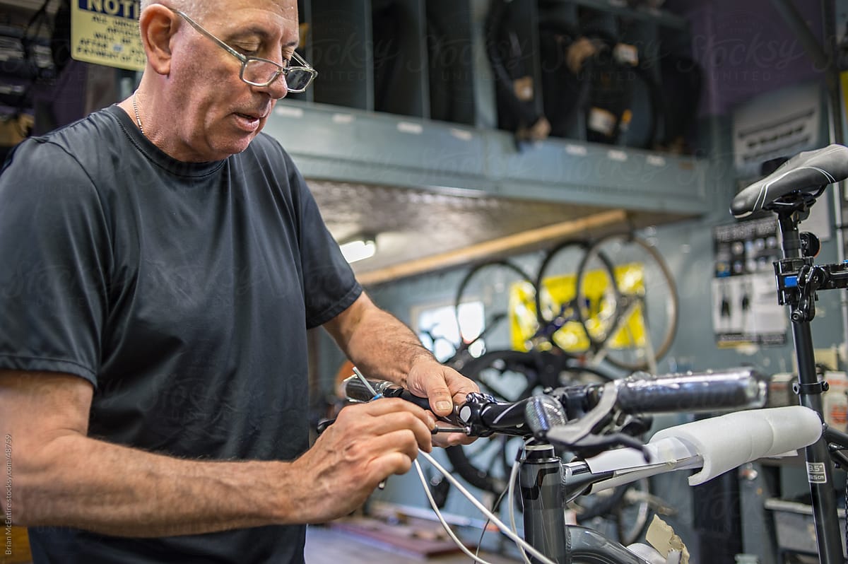 Local Bike Shop: Store Owner Assembles New Bicycle