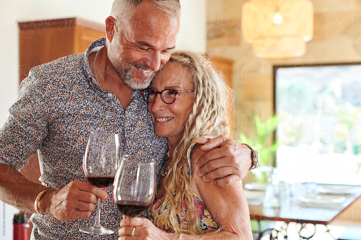 Loving mature couple drinking wine