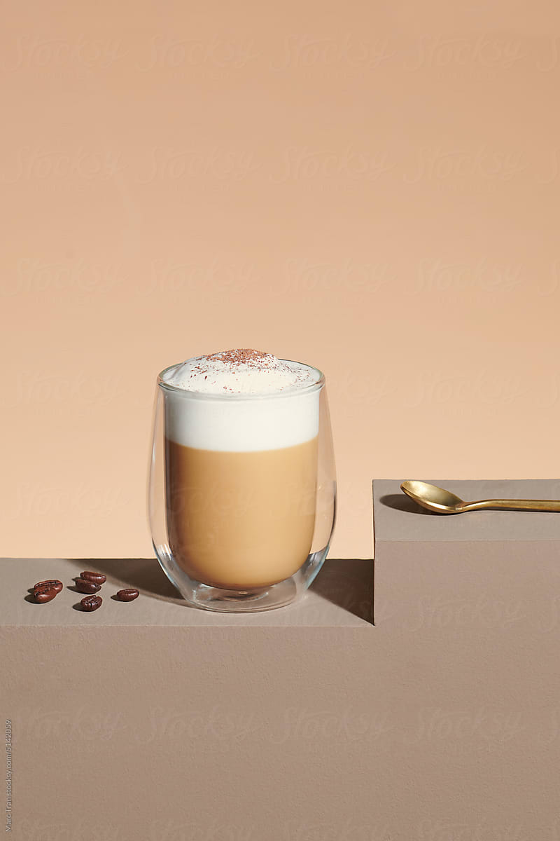 milk latte with thick foam in a glass
