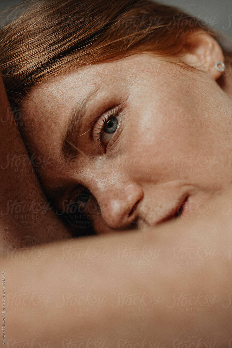Close Up woman\'s portrait of Ginger female with many freckles