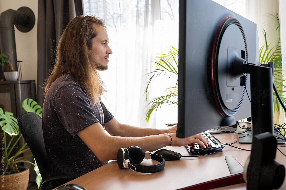 Man Working With Computer At Home