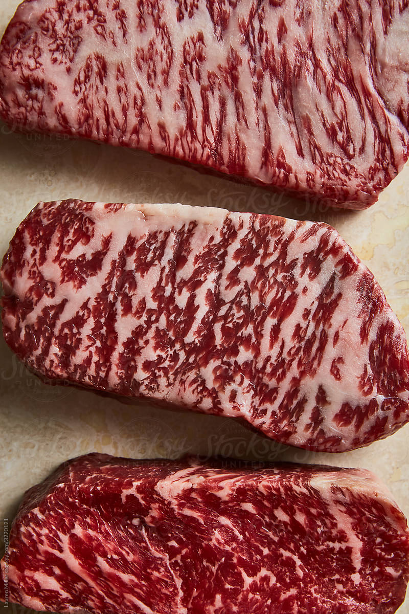 Three raw premium steaks
