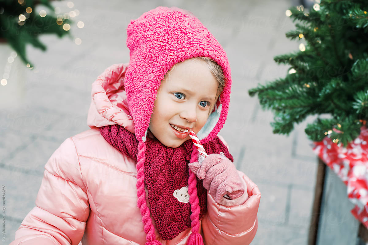 Festive Joy: Little Girl in Pink with Candy Cane