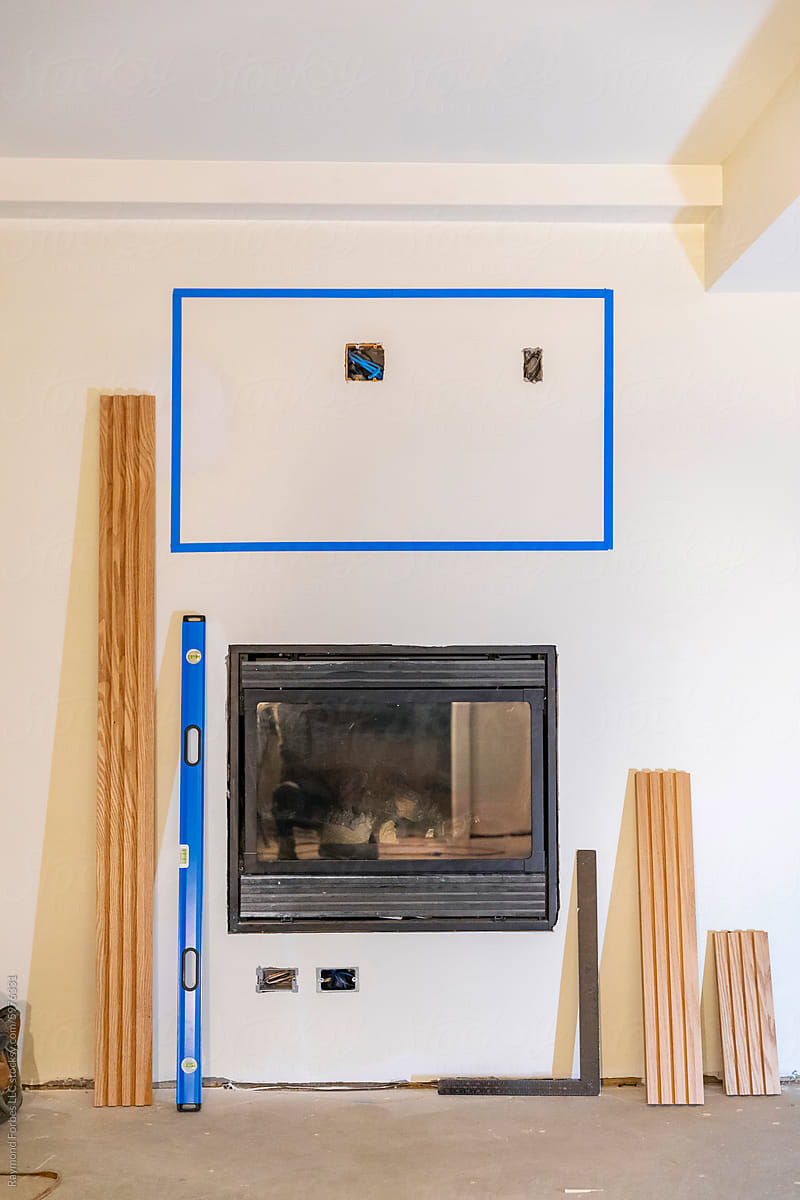 House Construction with gas fireplace and Marking for TV on wall wood
