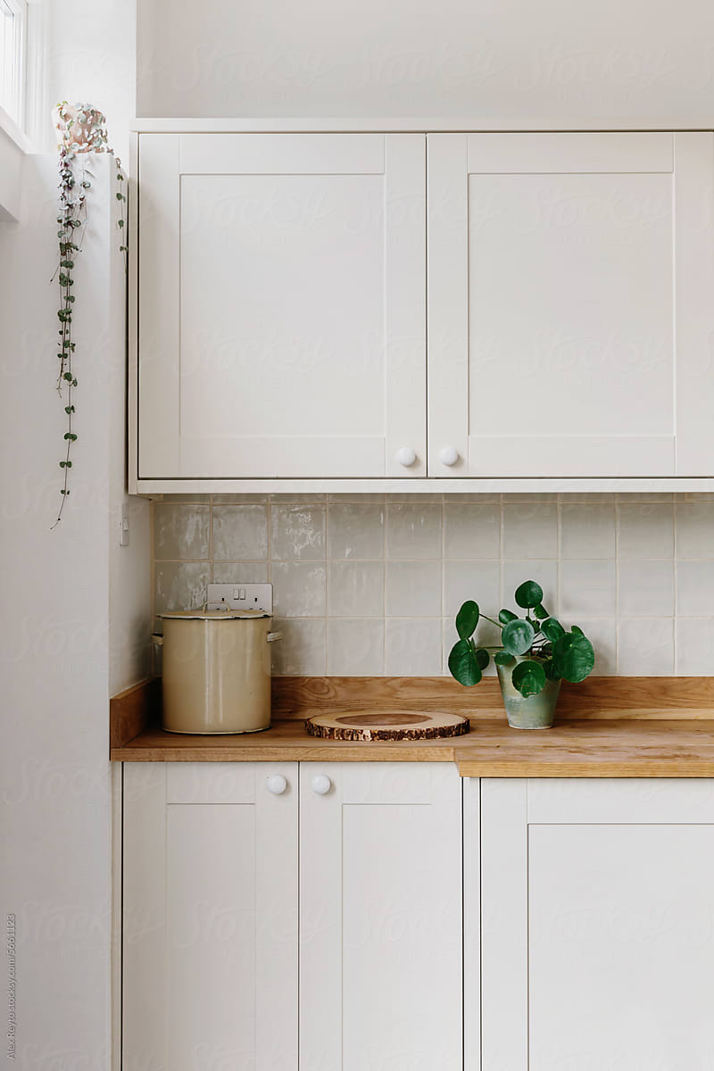 Detail of cream bespoke cabinets in a London kitchen.