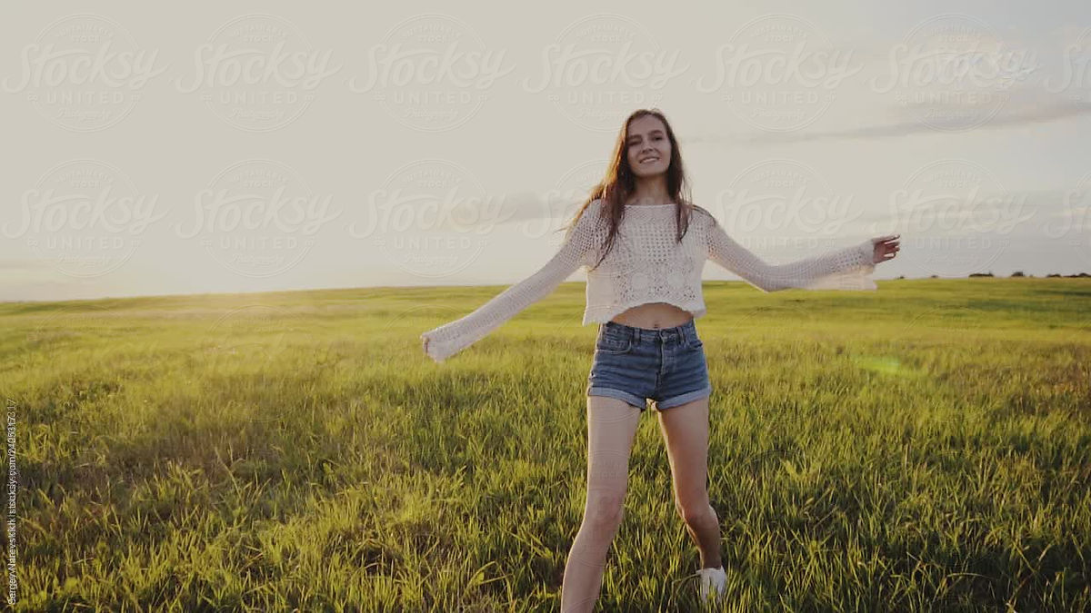 Skinny Young Woman Spinning In Field By Stocksy Contributor Sergey Narevskih Stocksy