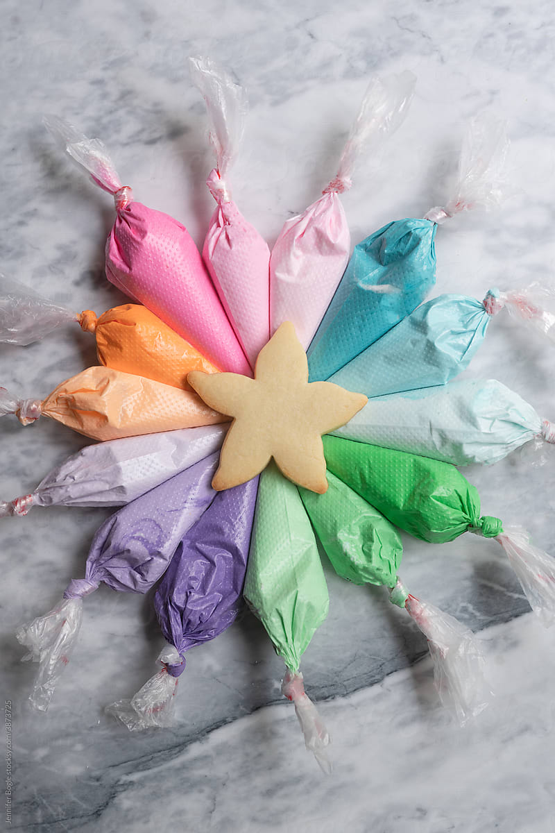 Rainbow frosting bags with starfish cookie