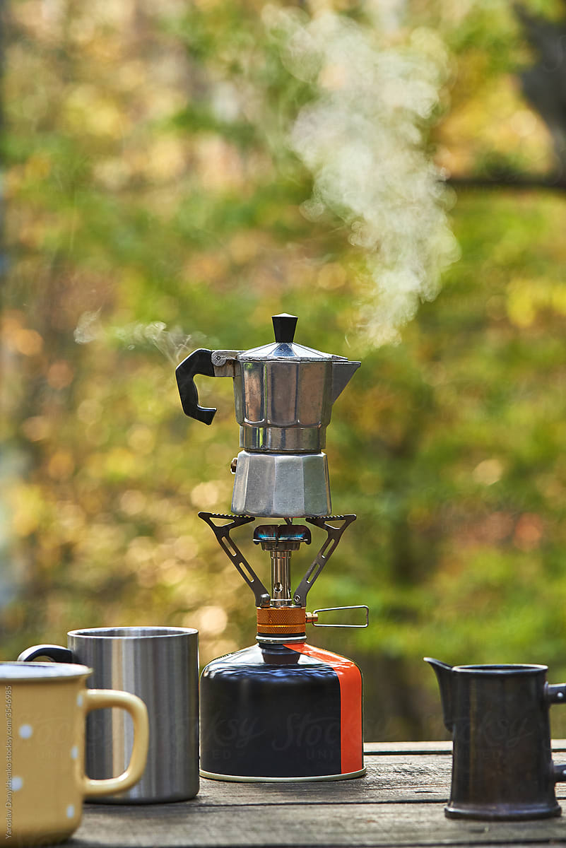 Metal Coffee Maker On A Camping Gas Stove. by Stocksy Contributor  Yaroslav Danylchenko - Stocksy
