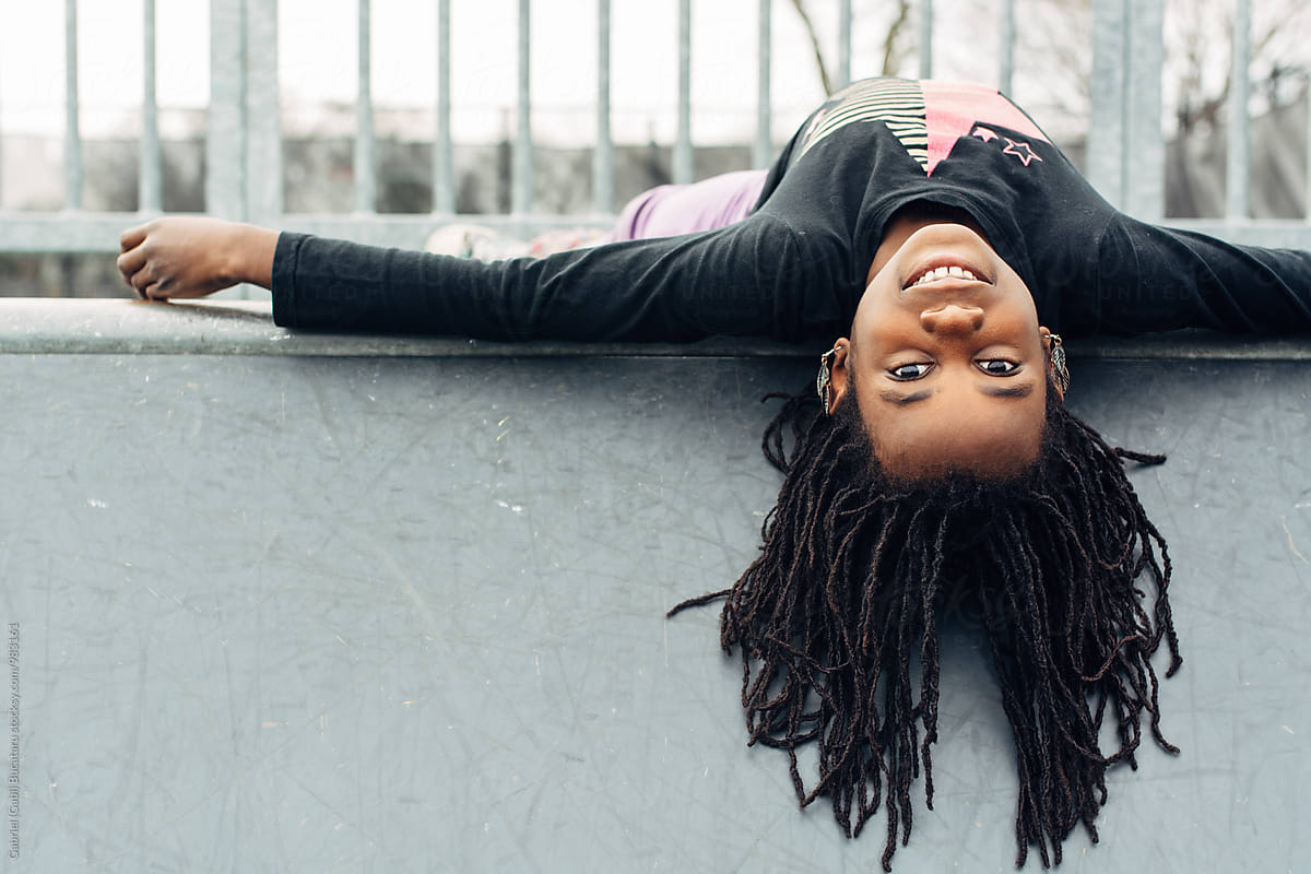 African American Girl Upside Down On A Skateboard Park Ramp By Stocksy Contributor Gabi