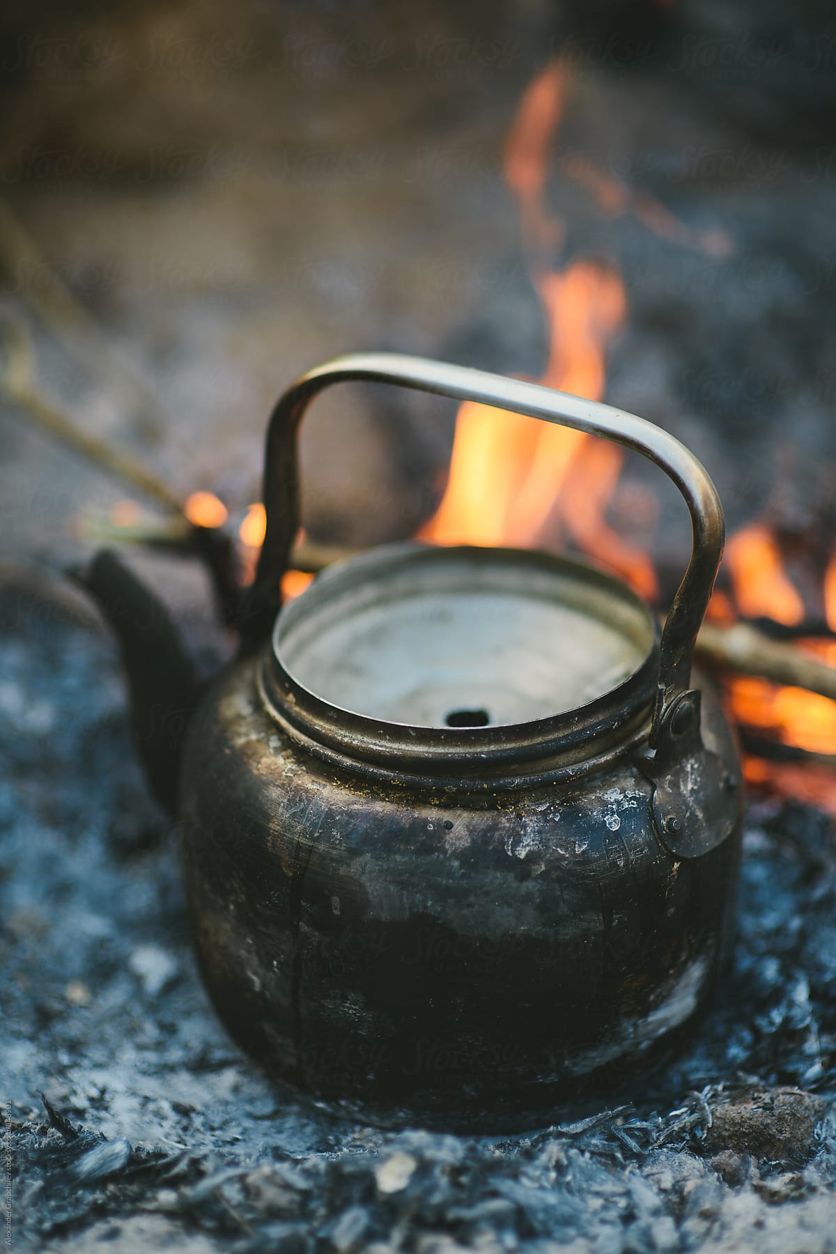 Old Kettle By A Camping Fire