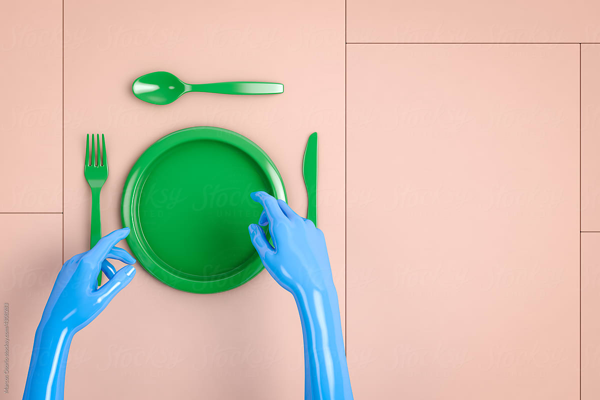 Hands next to cutlery and green plastic plate
