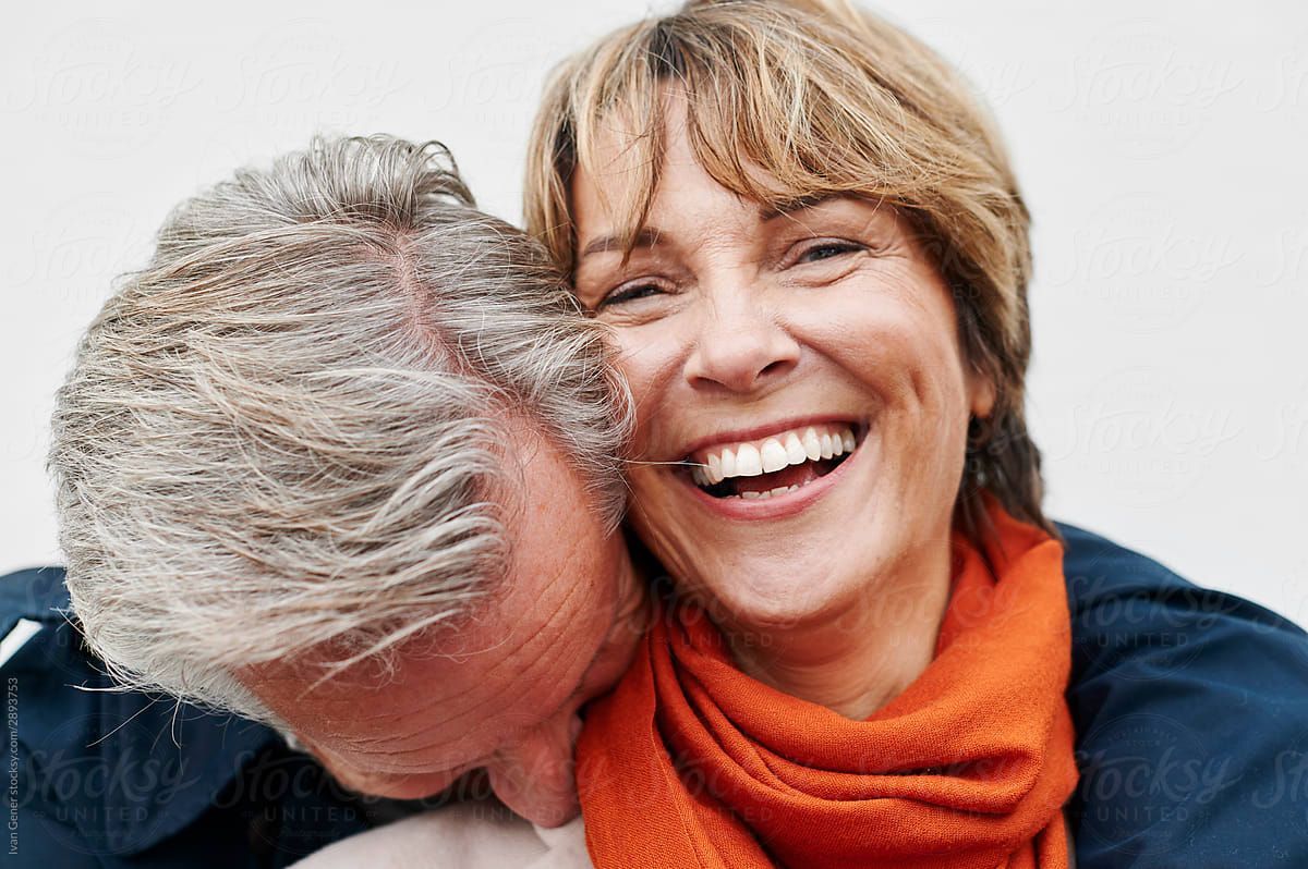 Man Hugging His Laughing Wife By Stocksy Contributor Ivan Gener Stocksy