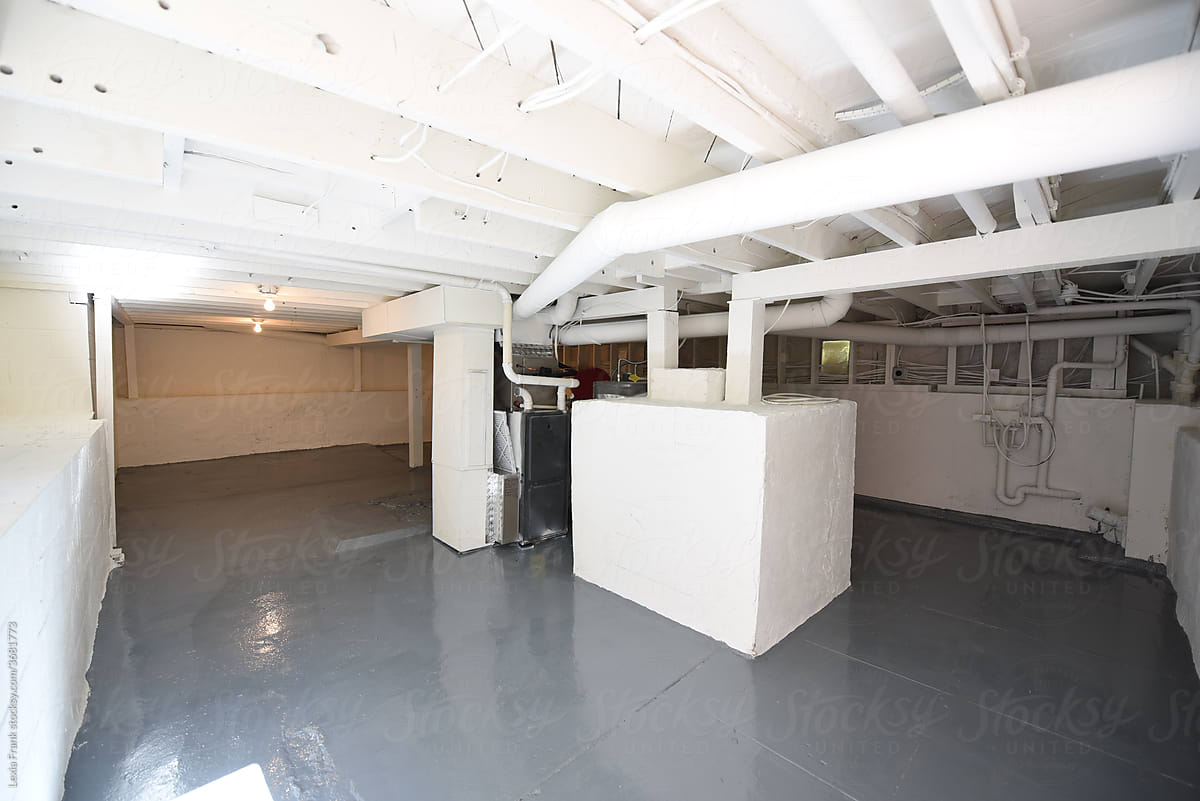 brightly lit clean and white unfinished basement
