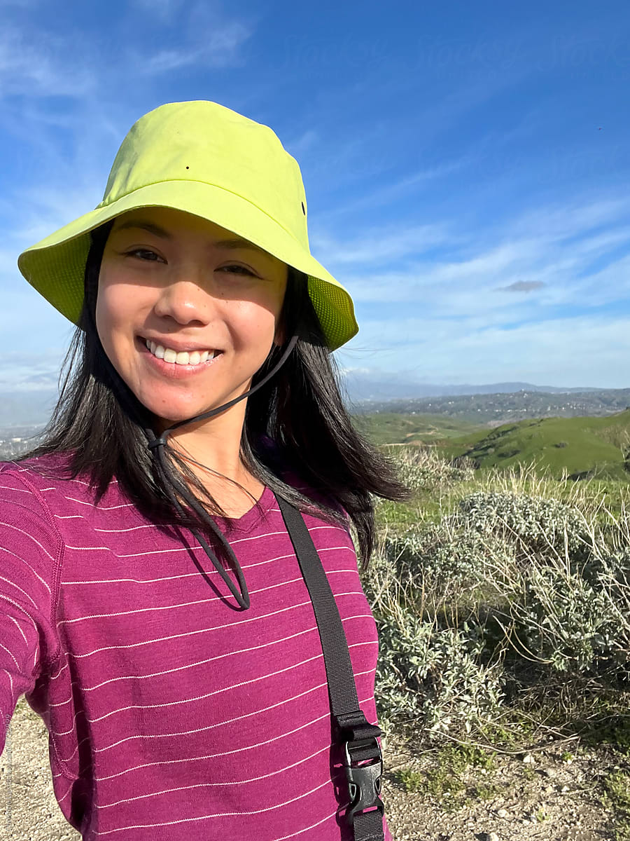 UGC selfie of young woman on a hike