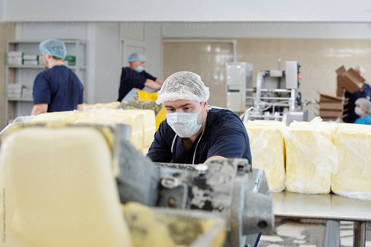 Workman At Butter Manufacturing Plant