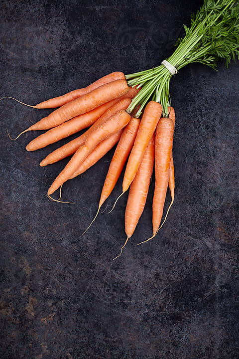 Hands Chopping The Carrot by Stocksy Contributor Milles Studio - Stocksy