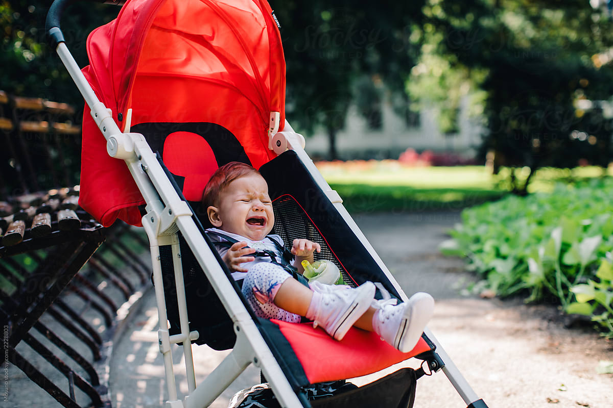 Crying Baby In A Stroller By Stocksy Contributor Mosuno Stocksy
