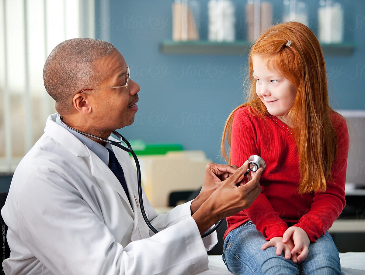 Exam Room Doctor Explains Stethoscope To Girl By Sean Locke Patient