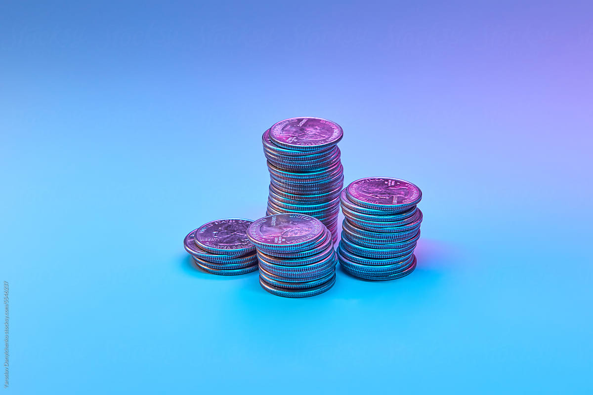 Cent coins against neon background.