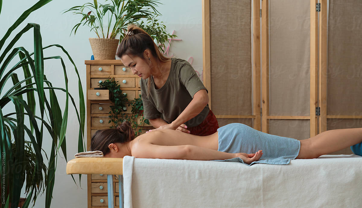 Woman getting relaxing massage of back