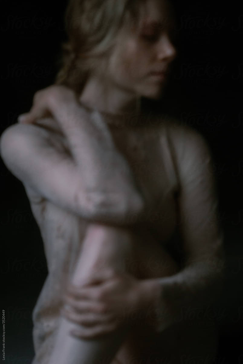 dark melancholy female portrait soft focus
