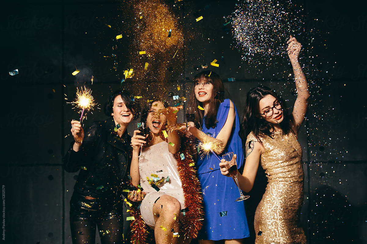 Four female posing with sparklers