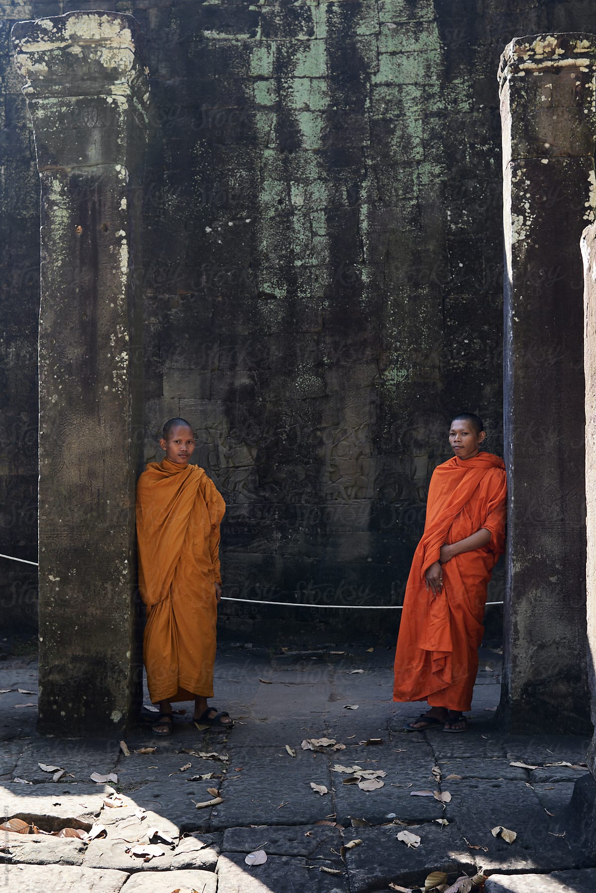 Monks in orange clothes standing