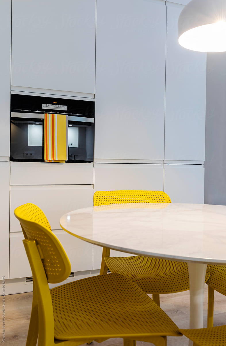 stylish Kitchen with yellow chairs