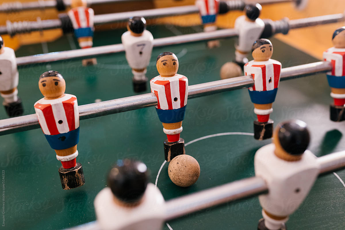 Table soccer game with wooden toys and cork ball