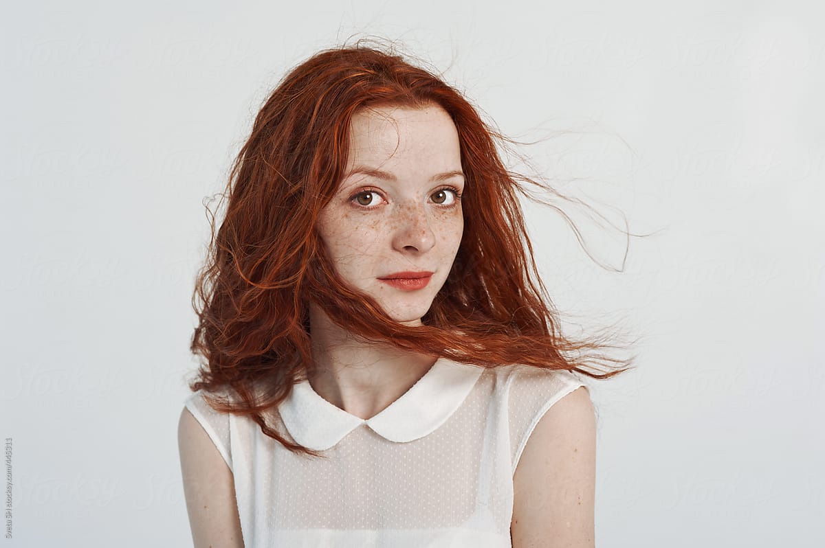 Red-haired girl in a white dress