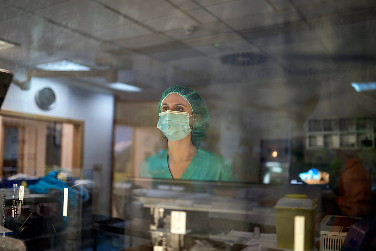 Portrait of surgeon in a medical mask during an operation
